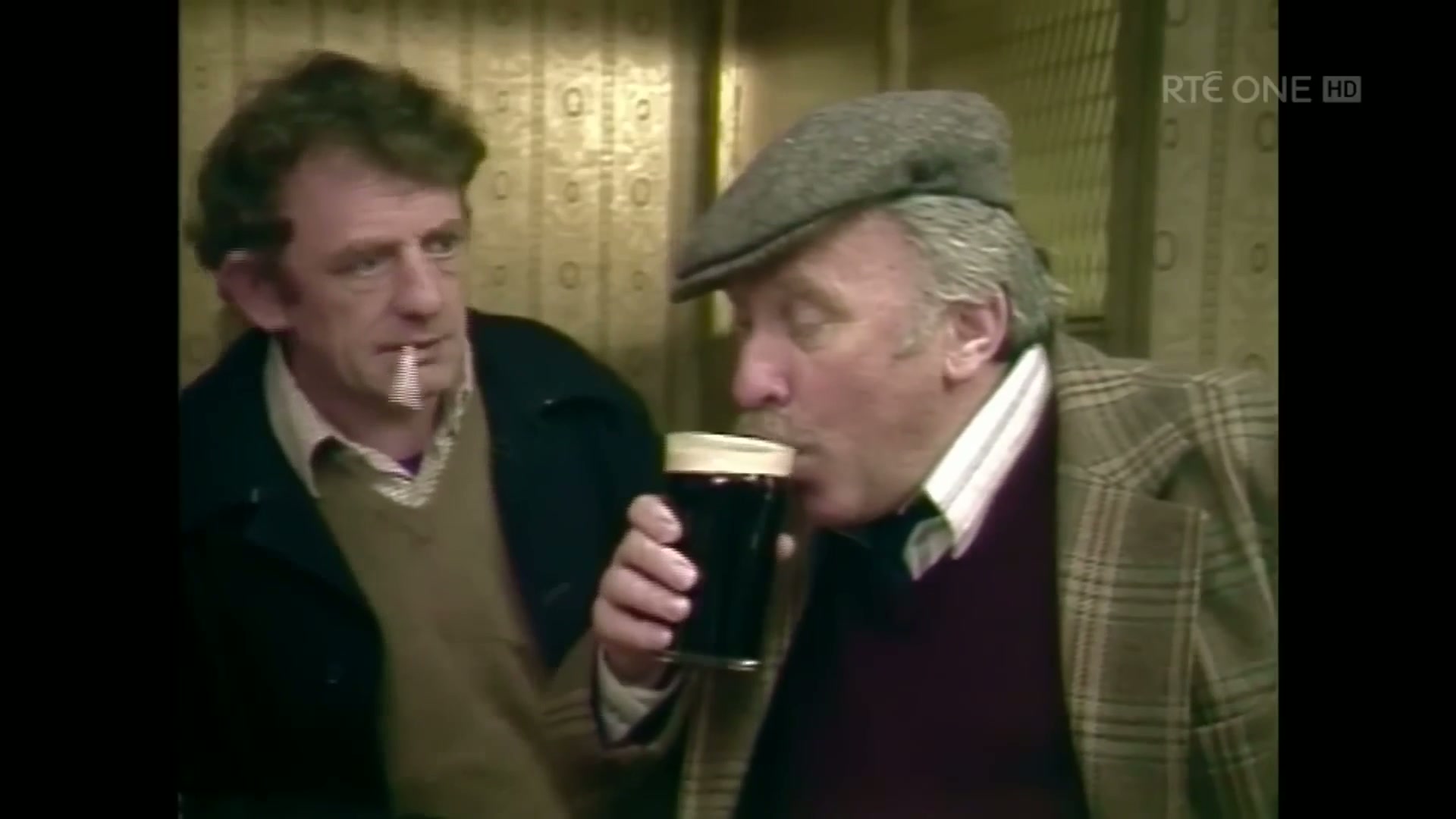 Joe Lynch (Dinny Byrne) drinking stout at the bar